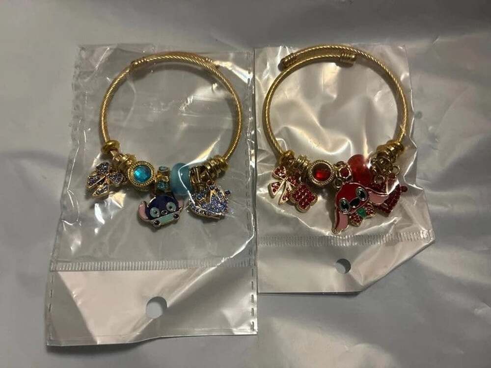 Set of 2 stitch and Leroy fashion bracelets red and blue gold tone new